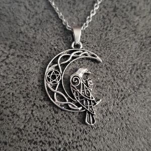 Raven sitting on a crescent moon celtic knotwork & pentagram necklace